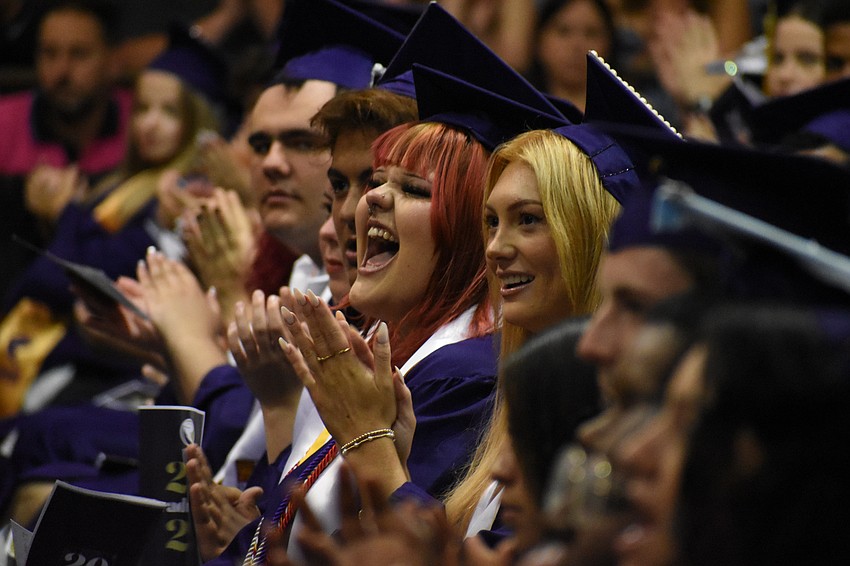 Students applaud during the ceremony.