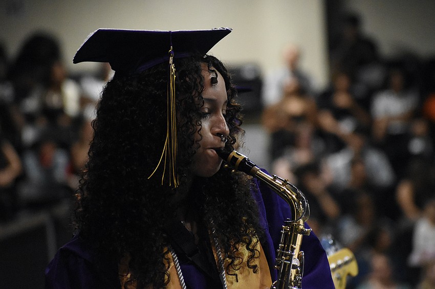 Mia Miles performs on saxophone.