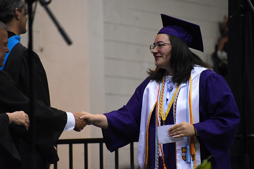 Ciana Bostock greets School Board Chair Tim Enos.