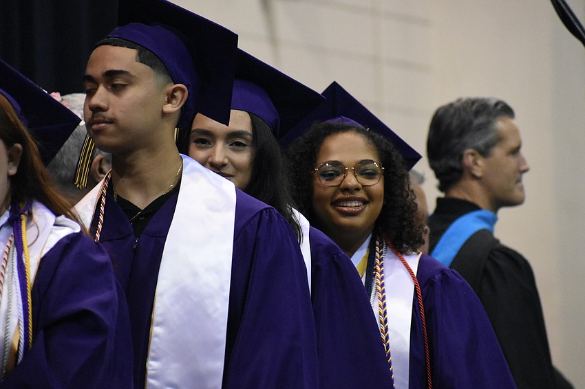 Alexander Avila, Anna Alarcon and Asia Jones proceed across the stage.
