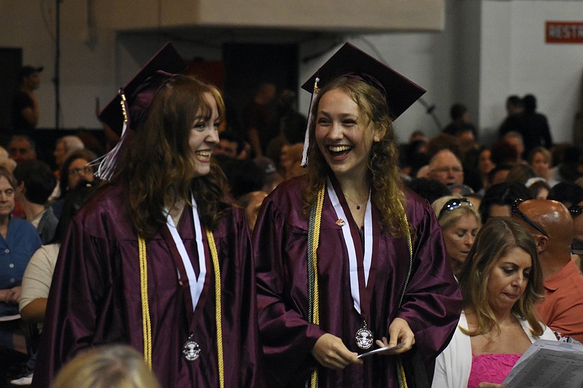 Frehley Spainhower and Elizabeth Grace Smalley walk the aisle.