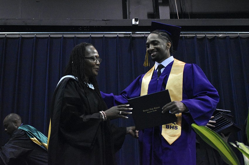 Principal Rachel Shelley greets Joshua Sobalvarro.