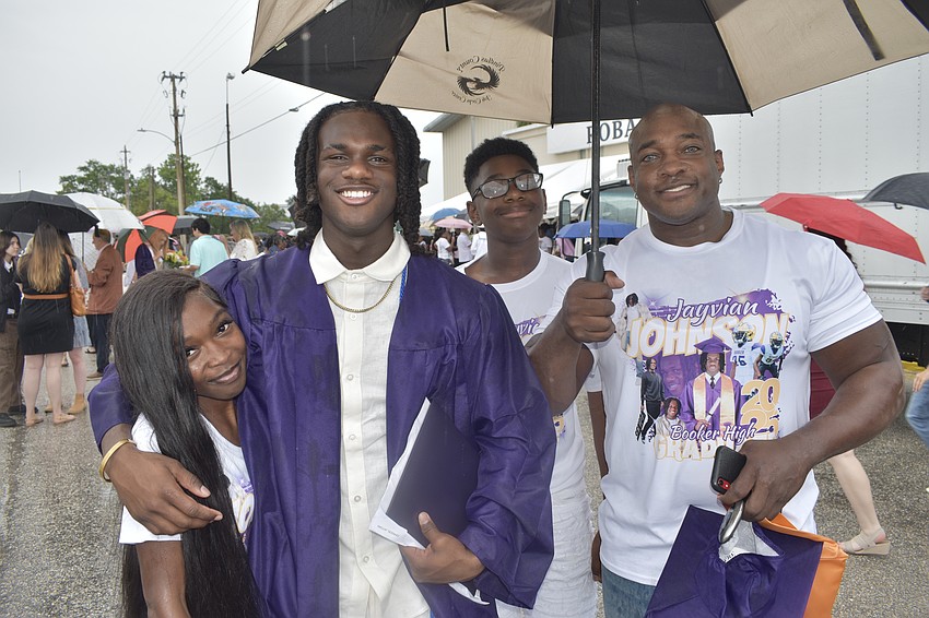 Graduate Jayvian Johnson (second from left), his girlfriend Alyssa Harris, brother Will Johnson and father Terrence Johnson