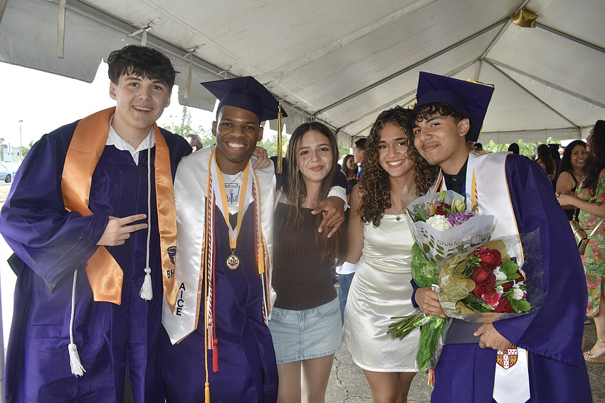 Graduates Sam Pirnik and Trenton Baker, Booker High School seniors Susanna Reyes and Maria Navarro, and graduate Kevin Mendoza