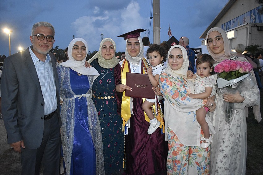 Graduate Judy Al-Rawi (center), her father Ali Al Rawi, sister Jenna Al Rawi, mother Hala Muhsin, cousin Sarah Al-Zubaidi, 2, aunt Ayah Muhsin, cousin Maryam Al-Zubaidi, 1, and sister Rayam Al-Rawi