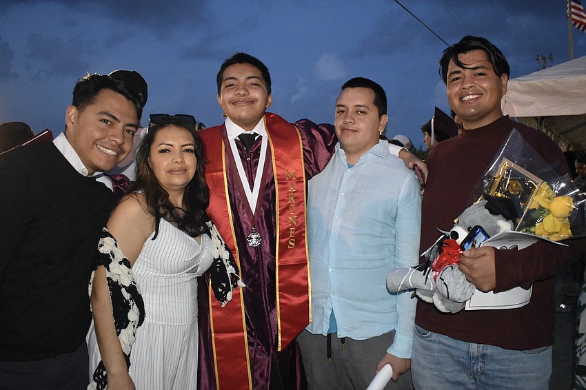 Graduate Jessy Zamarripa, his brother Ricardo Zamarripa, mother Liliana Chavez, and brothers Eric Zamarripa and Youani Chavez