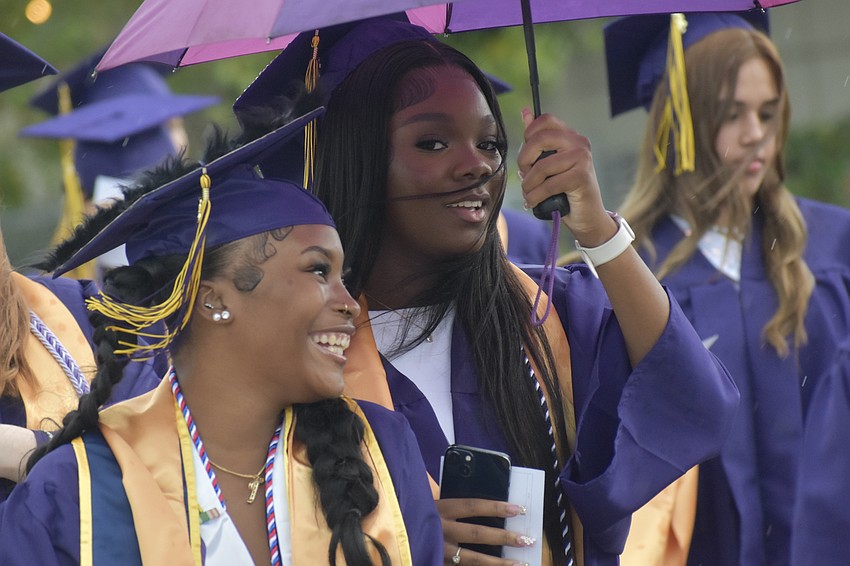 Ty'reyah Williams and Shandrea Williams proceed into Robarts Arena with the other graduates.