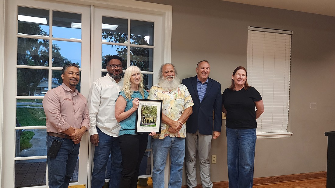 Amy Quesinberry Price, of Winter Garden, was honored by the Oakland Town Commission for her work covering the Oakland Town Commission for the West Orange Times & Observer for the past 35 years.