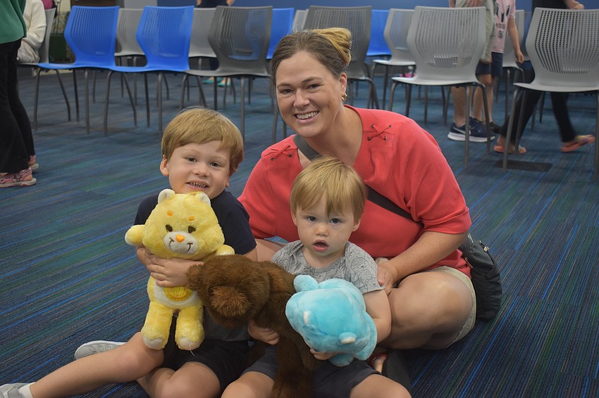 Lakewood Ranch residents Kelly Elkins, 4-year-old Maverick Elkins and 2-year-old Jackson Elkins enjoy the show with their Care Bears.
