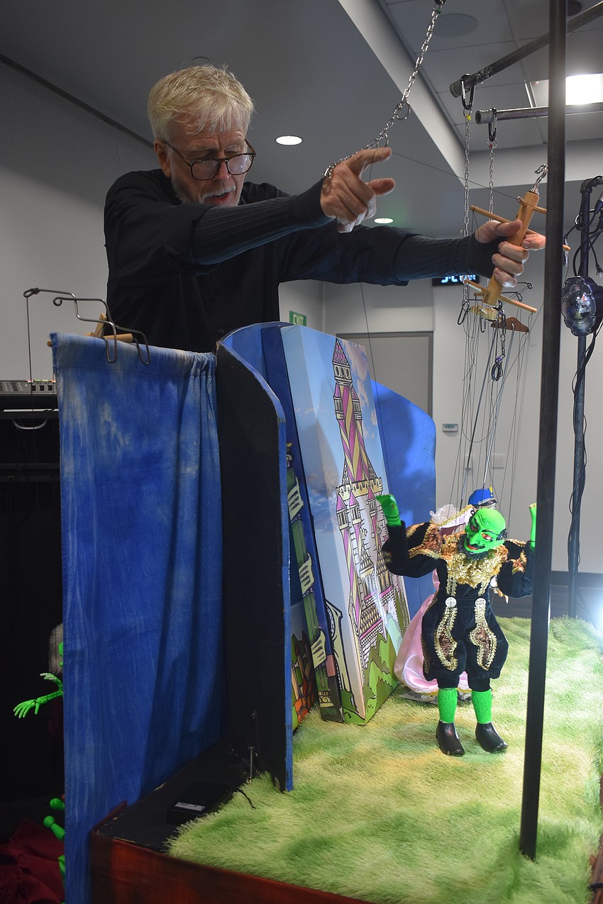 During his shows, Bickel is changing his voice for different characters while controlling the puppets and lighting to further the effects of the story.