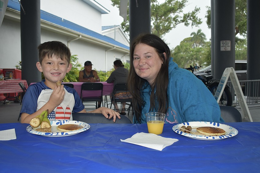 Kaysan Hunter, 6, and his mother Alex Hunter, enjoy pancakes.