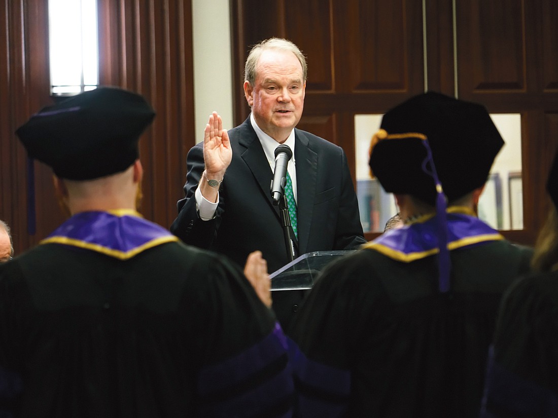 Senior U.S. District Judge Timothy Corrigan mock administers the Oath of Admission to the first graduating class of the Jacksonville University College of Law at the inaugural commencement ceremony May 2 at the Duval County Courthouse.