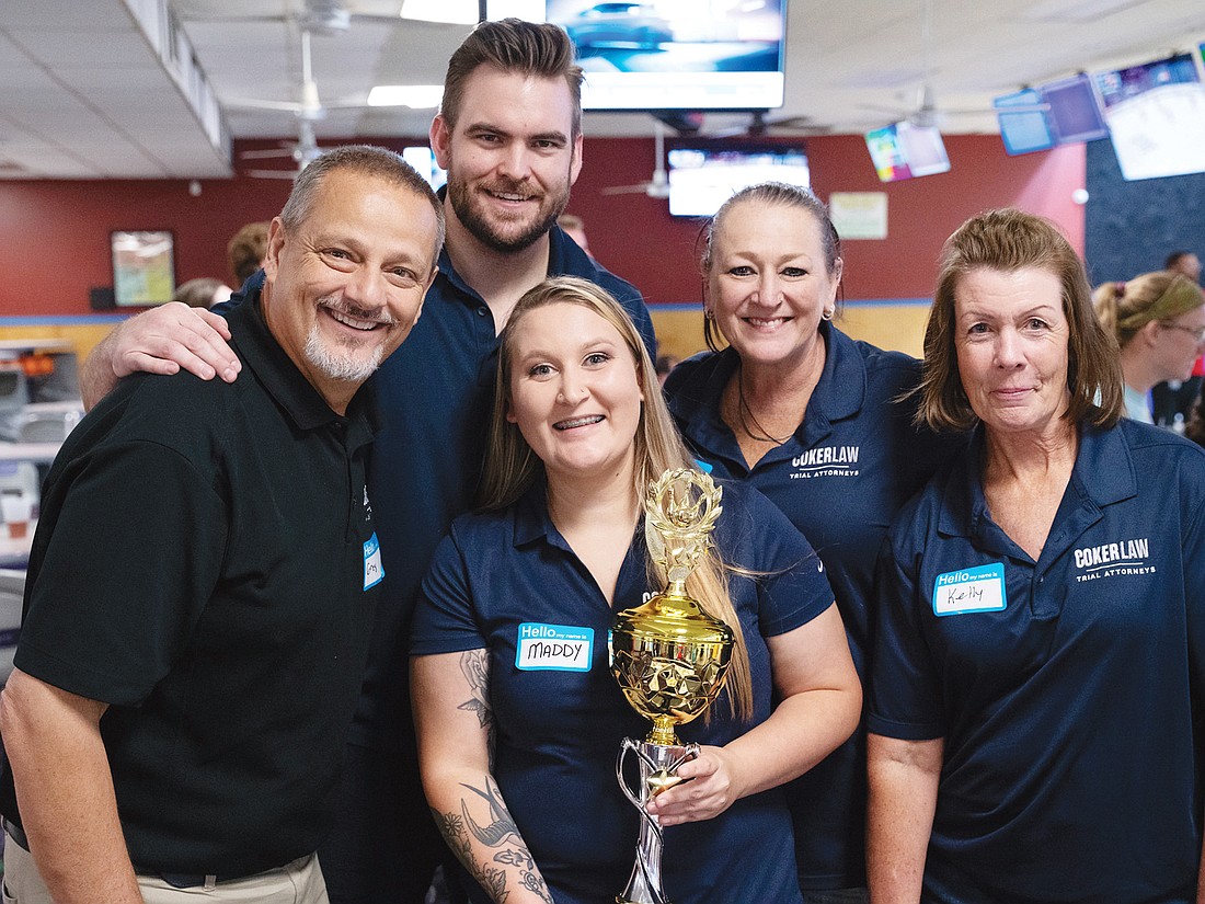 The team from Coker Law took home the Legacy Trophy after the Young Lawyers Section’s Pin Pals bowling tournament to benefit Special Olympics Florida. From left, Greg Oboikovitz, Tucker Norton, Madyson Lambert, Jacki Olson and Kelly Anderson.