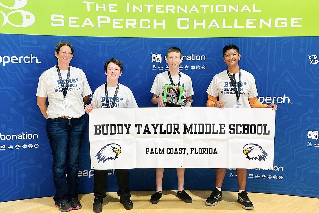Team Swift Sharks from Buddy Taylor Middle School at the International
SeaPerch Challenge: SeaPerch advisor Tracy Jones and team members Luke
Chrzanowski, James Webb and Alex Mangal. Courtesy photo