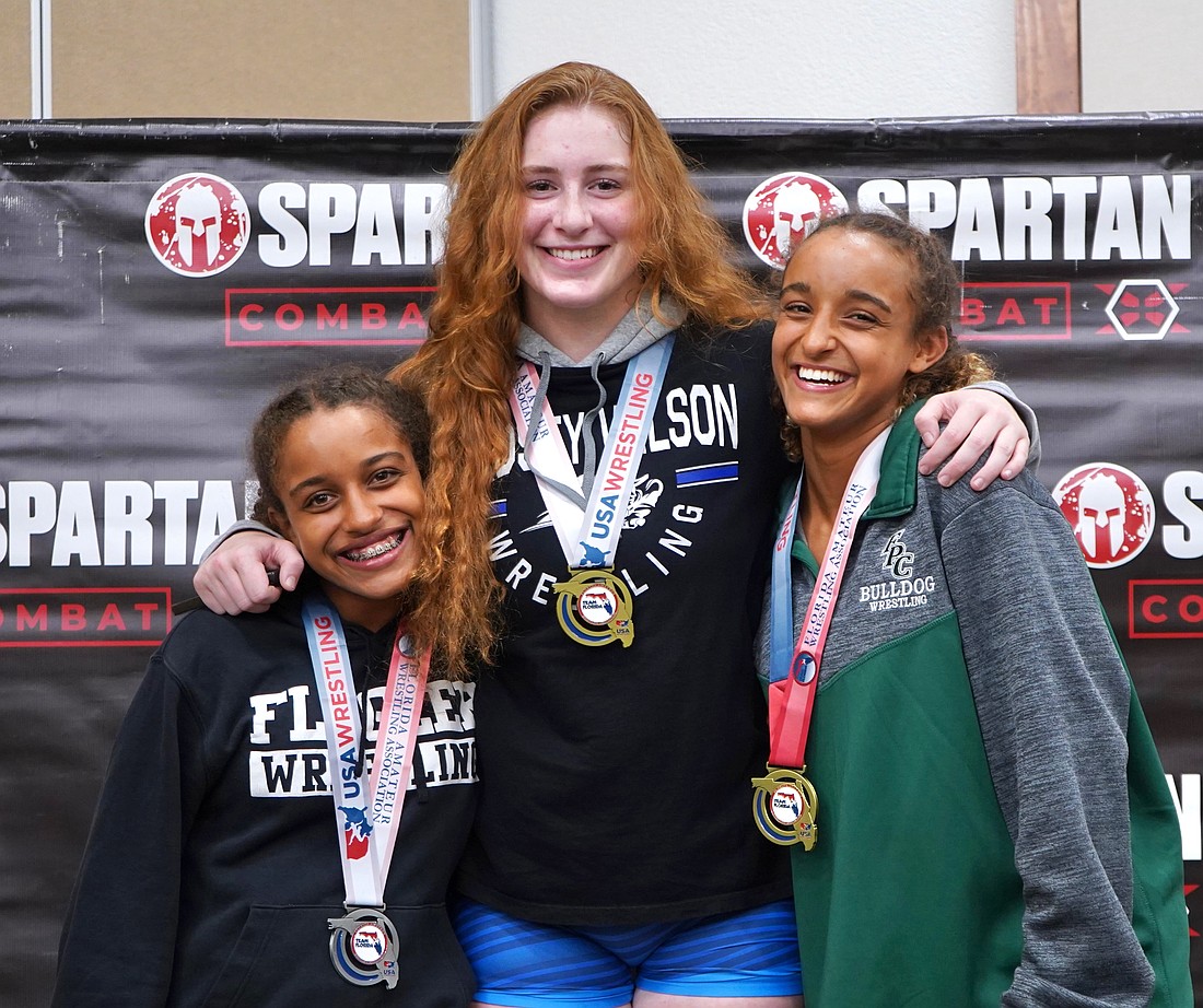 Juliana Mills, Kendall Bibla and Mariah Mills all qualified for the U.S. Marine Corps Junior Nationals in July at Fargo, North Dakota. Courtesy photo by Rachel Mills