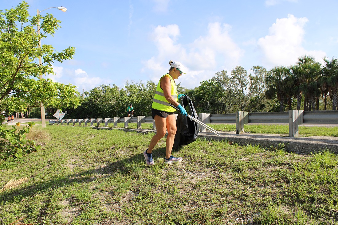 Volunteers including Sally Werner combed the entire area near Overlook Park, from the roadside to the water's edge, at the adopt-a-highway cleanup.