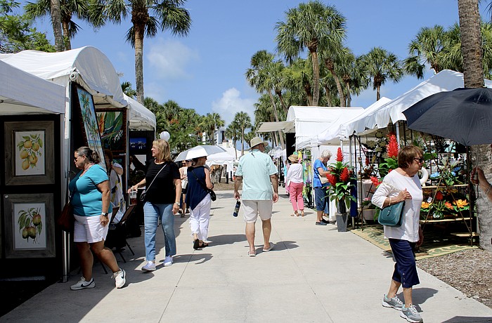 Early attendees beat the heat at last weekend's St. Armands Circle Craft Festival, which featured artisans in a variety of specialties.