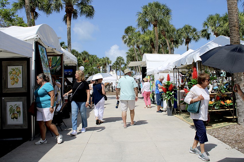 Early attendees beat the heat at last weekend's St. Armands Circle Craft Festival, which featured artisans in a variety of specialties.