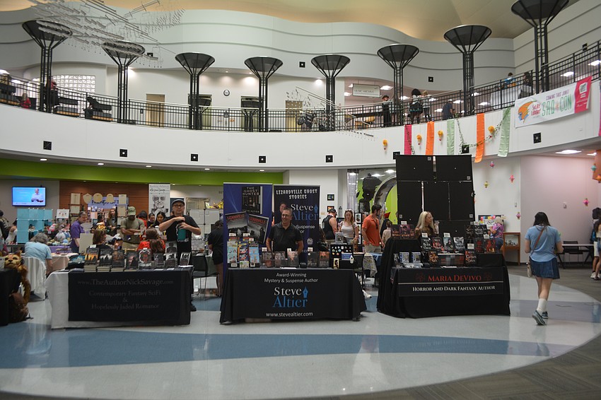 Much to find at booths for SQRCon 2025 like books, trinkets and crochet plushes.