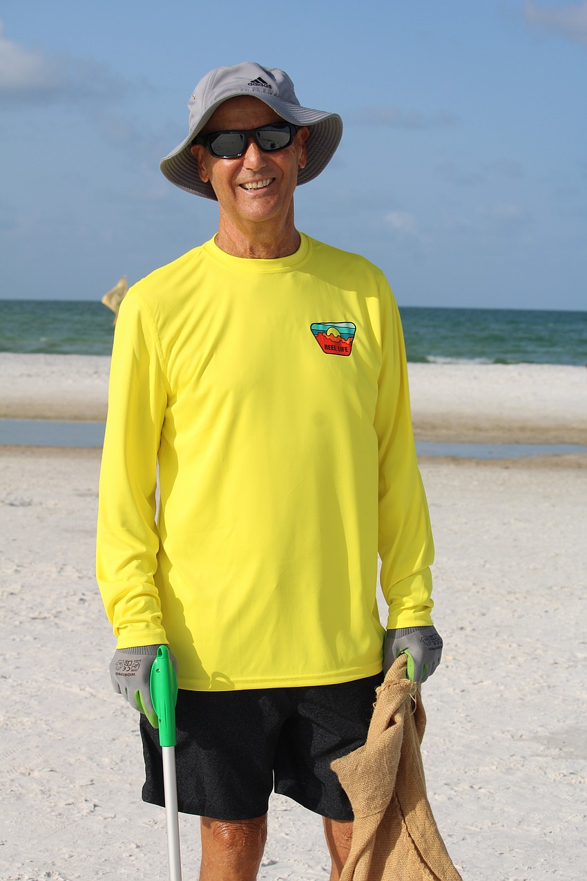 Frequent beach cleaner Jerry Uhl helps out at Siesta Beach for a World Ocean Day-themed cleanup, organized by Sarasota County and Mote Marine Laboratory & Aquarium.