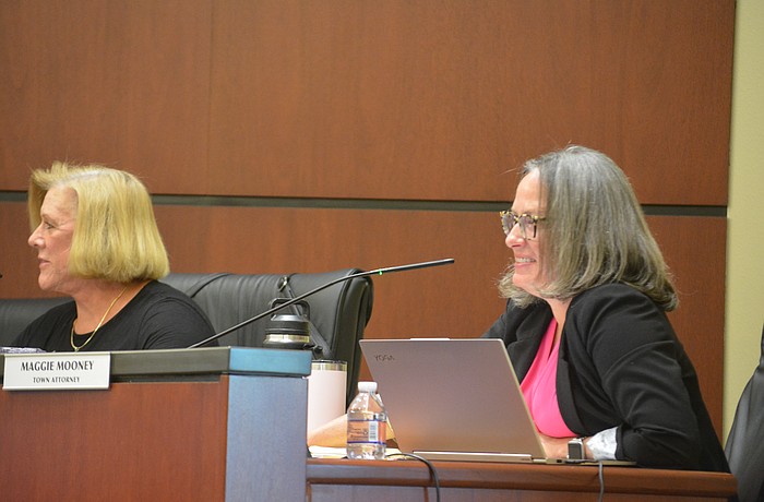 Commissioner-At-Large BJ Bishop (left) Town Attorney Maggie Mooney (right).