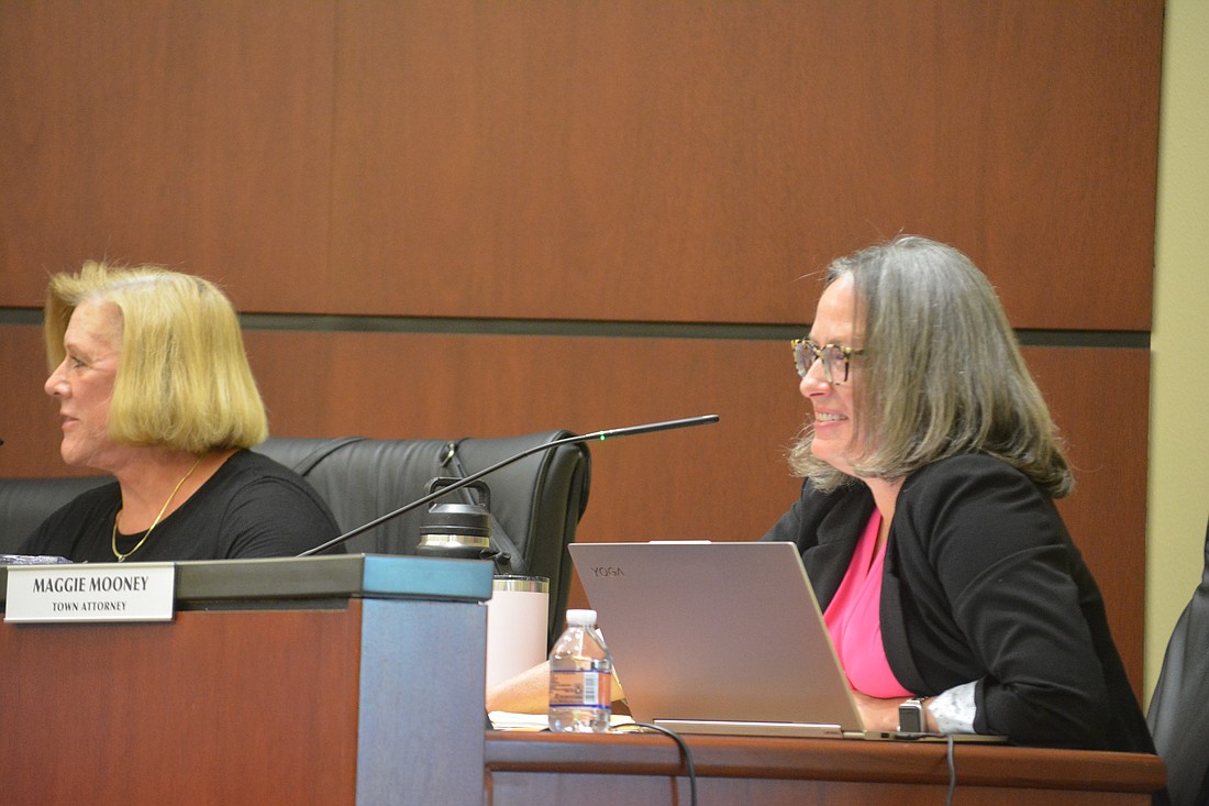 Commissioner-At-Large BJ Bishop (left) Town Attorney Maggie Mooney (right).