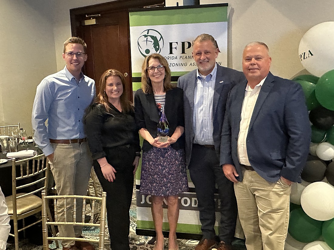From left, England-Thims & Miller Survey Senior Project Manager Charlie Schreiner, ETM Senior Planner Casey Dendor, Jacksonville Daily Record Editor at Large Karen Brune Mathis, ETM Senior Landscape Architect Kevin White and ETM Survey Vice President and shareholder Barry Scott.