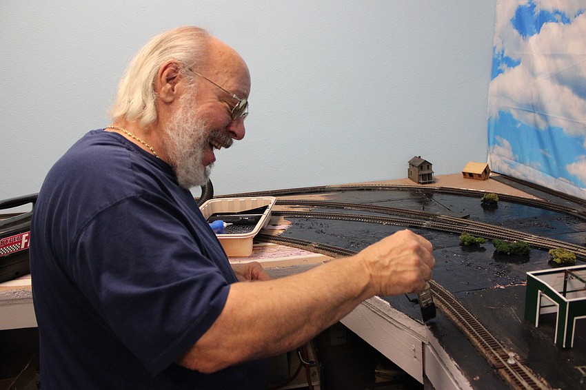 RealRail member John Schmidle enjoys himself as he gets an HO layout ready for the 50th anniversary celebration.