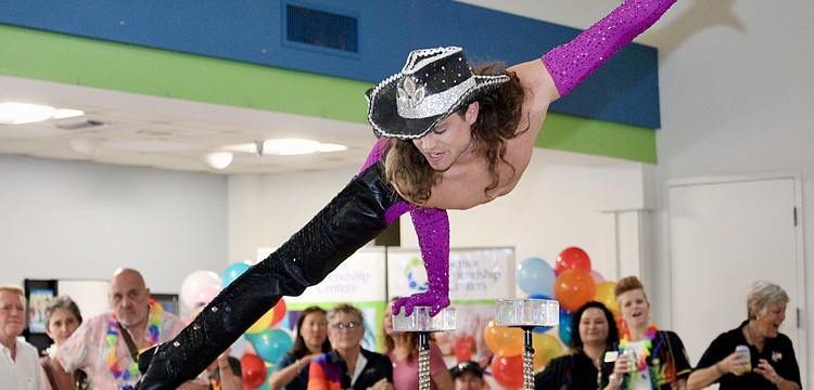 Michael Knapp, stage name Greta Gripp, performs an acrobatic routine at the Silver Pride celebration June 7 at Senior Friendship Centers.