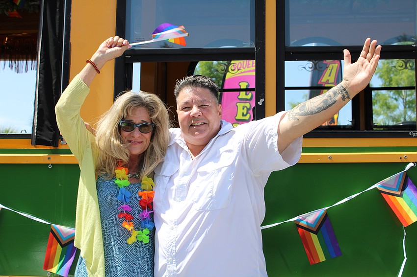Friends Cathy Orban and Toni Wright share a smile after a trolley ride through downtown Sarasota for Pride Month.