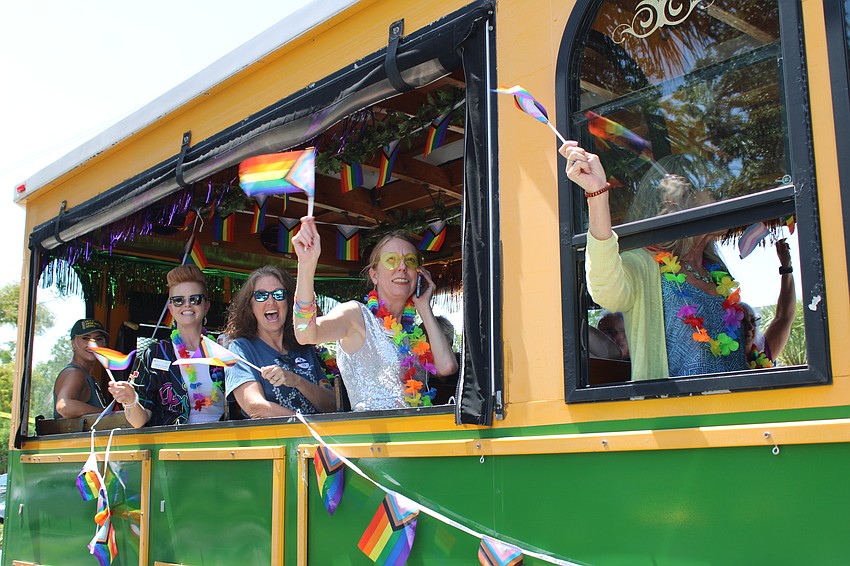 Silver Pride attendees waved their flags as they prepared to cruise through downtown before returning to Senior Friendship Centers.