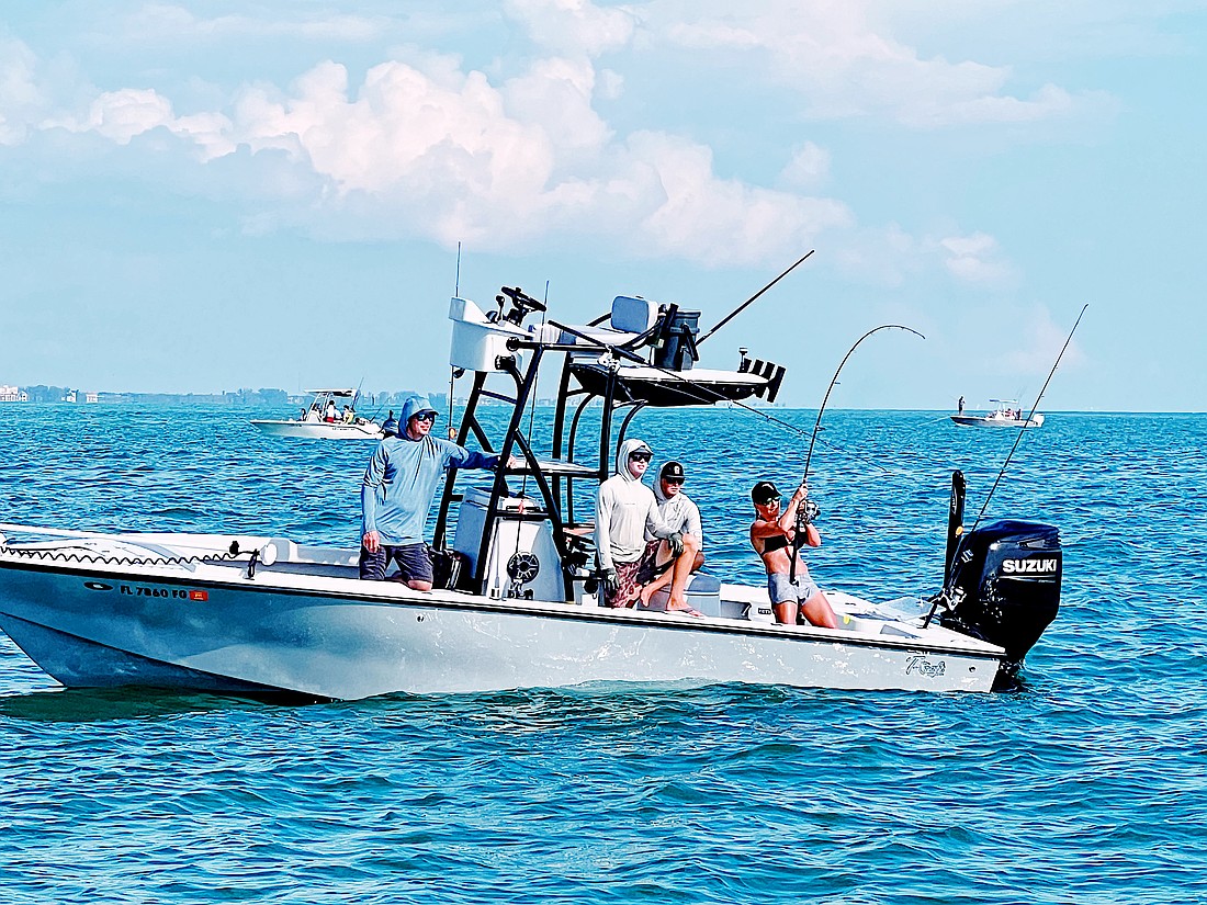A customer hauls in a catch aboard Capt. AJ Grande's charter boat.