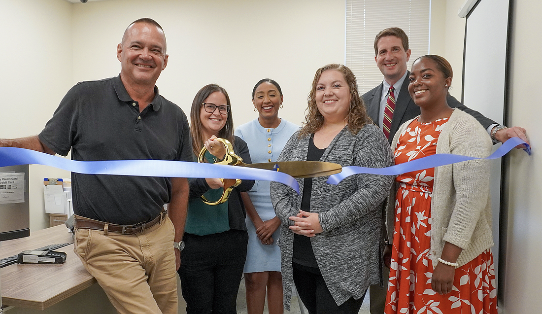 The St. Johns County Clerk of the Circuit Court and County Comptroller’s Office cut the ribbon at its new annex in Julington Creek on June 4. Pictured left to right: Scott Augustine, St. Johns County project manager; Kati Smith, recording director; Ashanti Austin, chief administrative officer; Kimberly Jarrell, recording supervisor; Brandon J. Patty, clerk of the circuit and comptroller; and Zhane Brown, recording clerk.