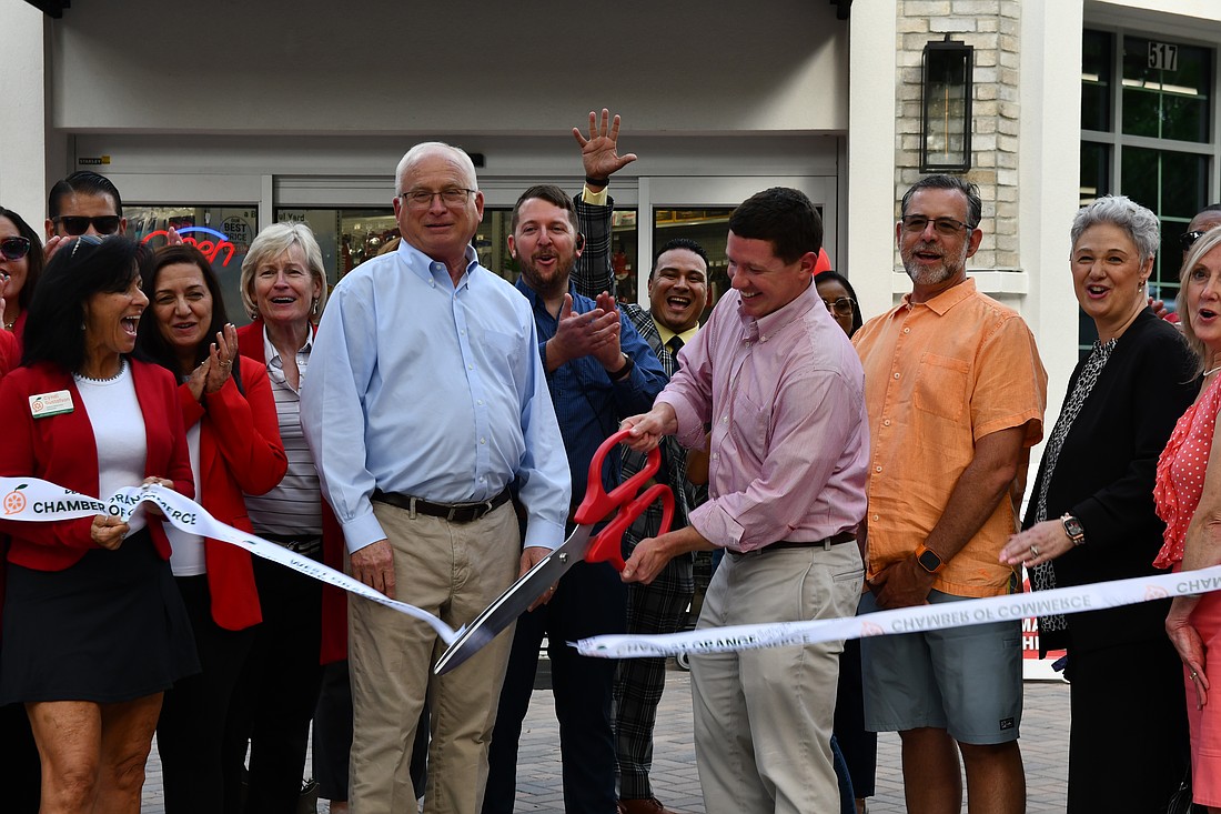 Walter Toole, left, the owner of Toole’s Ace Hardware, celebrated the opening of his latest store on Main Street with Neil Asma, the president and CEO of Toole’s Ace Hardware.
