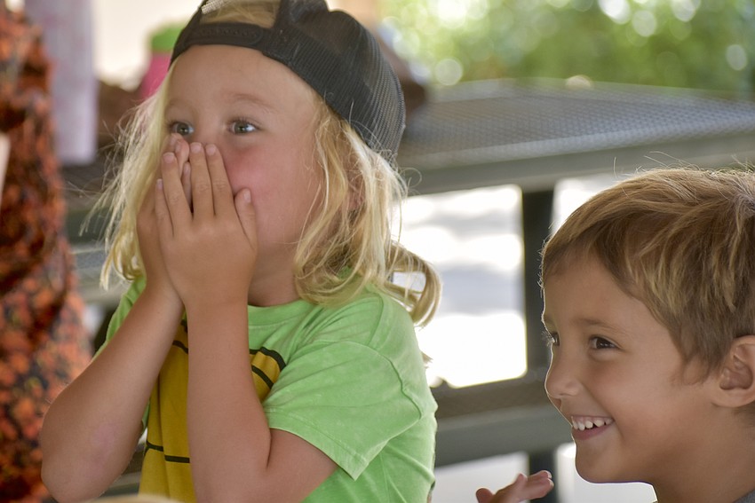 Jack Kenna, 4, emphatically touches his nose during 