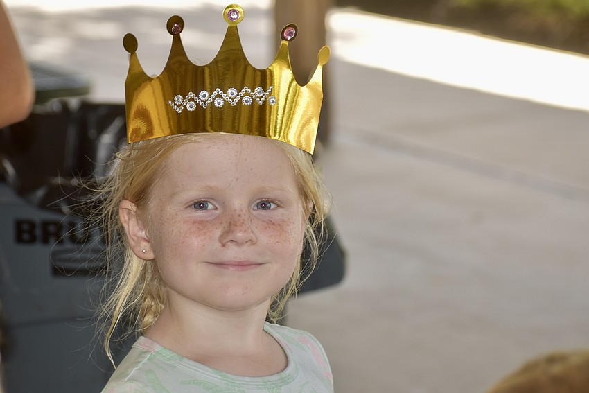 East County's Brooklyn Hittle, 4, shows off the craft of the day — a bedazzled crown.