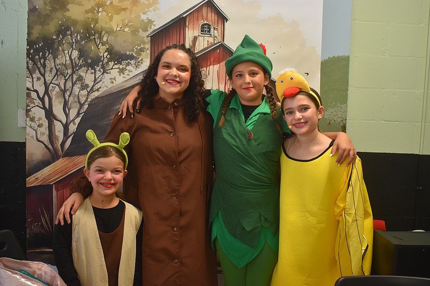 Ovation students Sadie Freeland, Aurelia Yepez, Gabriella Giobergia and Mia Schneider have a little fun before they begin their performance of 