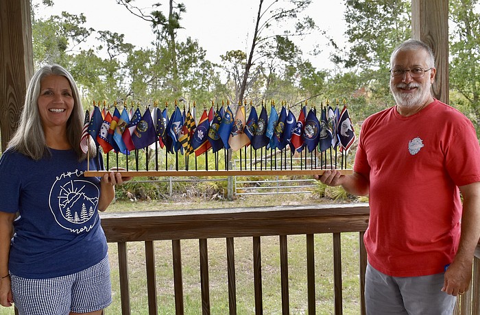 Myakka City's Diane and Rich Bartoszek collect flags from each state they visit.