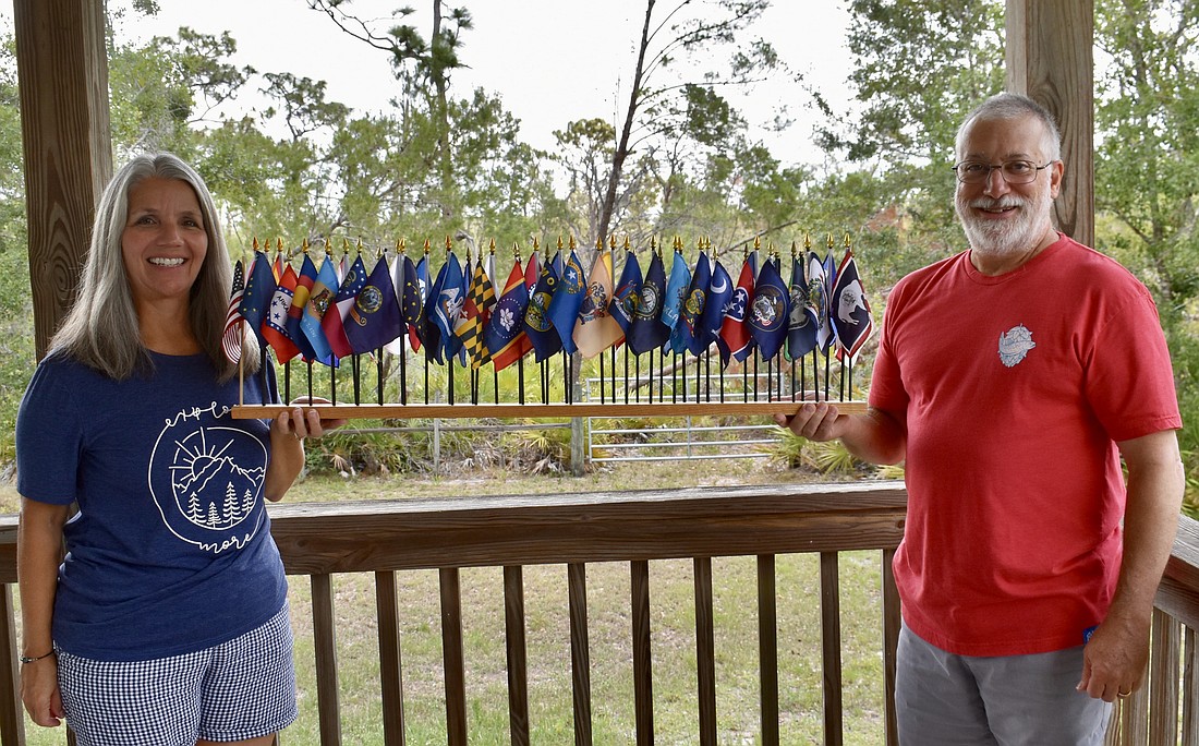 Myakka City's Diane and Rich Bartoszek collect flags from each state they visit.