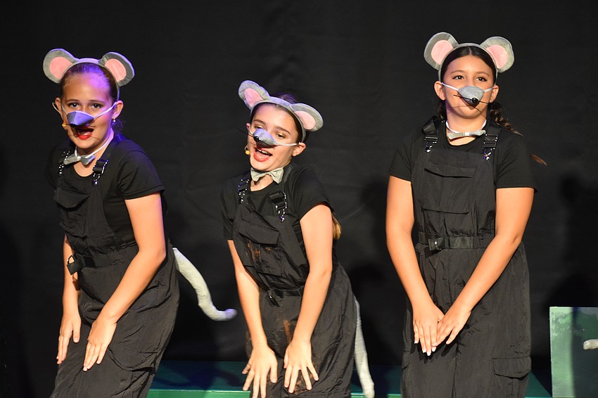 Amelia Shamieva, Mia Schneider and Gabriella Giobergia play the rats in the song 
