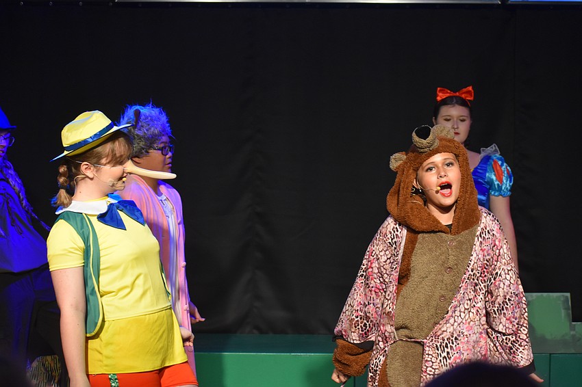 Scarlett Radtke plays Pinocchio and Amelia Shamieva plays Mama Bear.