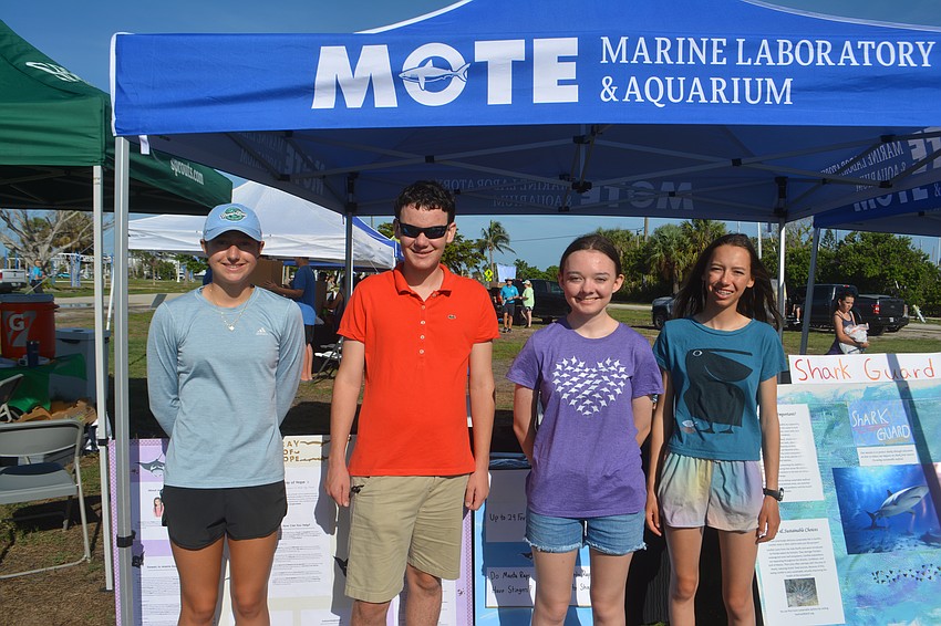 Homeschooled students: Jiselle Sulinski, Brice Claypoole, Presley Cochran, Coco Claypoole present and educate volunteers on the importance to stingrays and sharks.