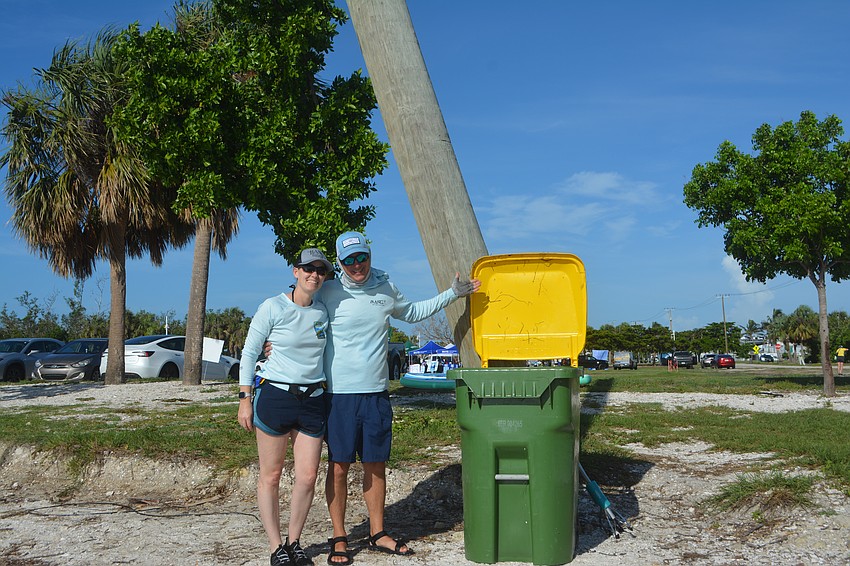 Kelli Carter and Jeff Lyons are a part of the Paddle Patrol and were able to fill a whole trashcan from the ocean.