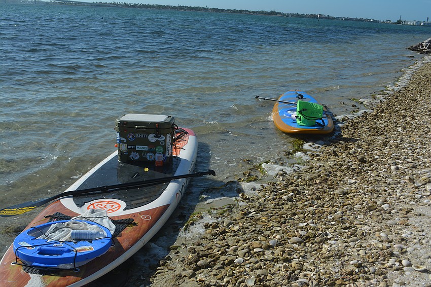 Close up on Kelli Carter and Jeff Lyons' paddle boards that were used to pick up debris and trash from the water.