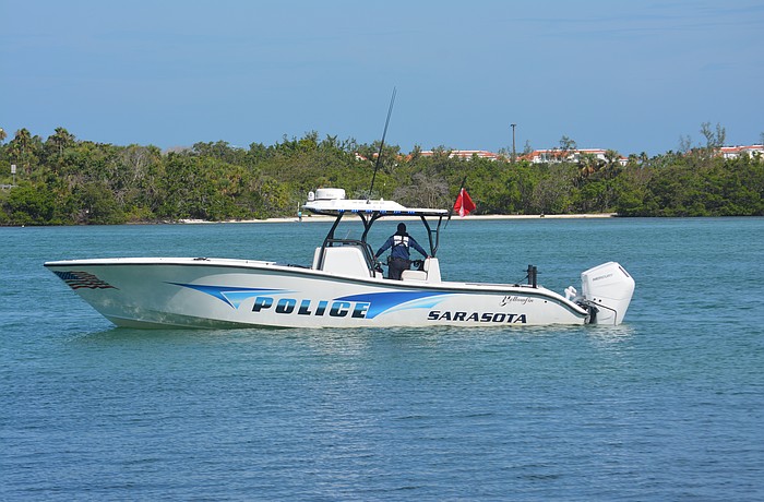 Sarasota Police force patrolling the waters to make sure the diving team is safe from the heavy currents.