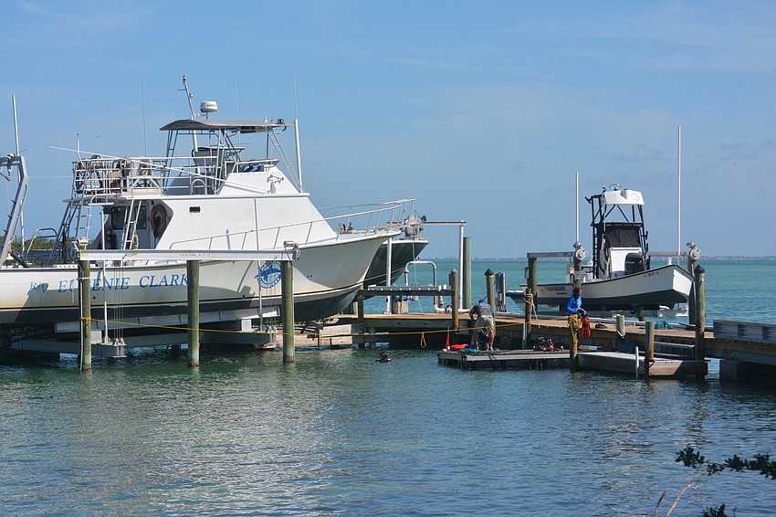 The volunteer diving team in action getting the last pieces of debris and trash out for the day.