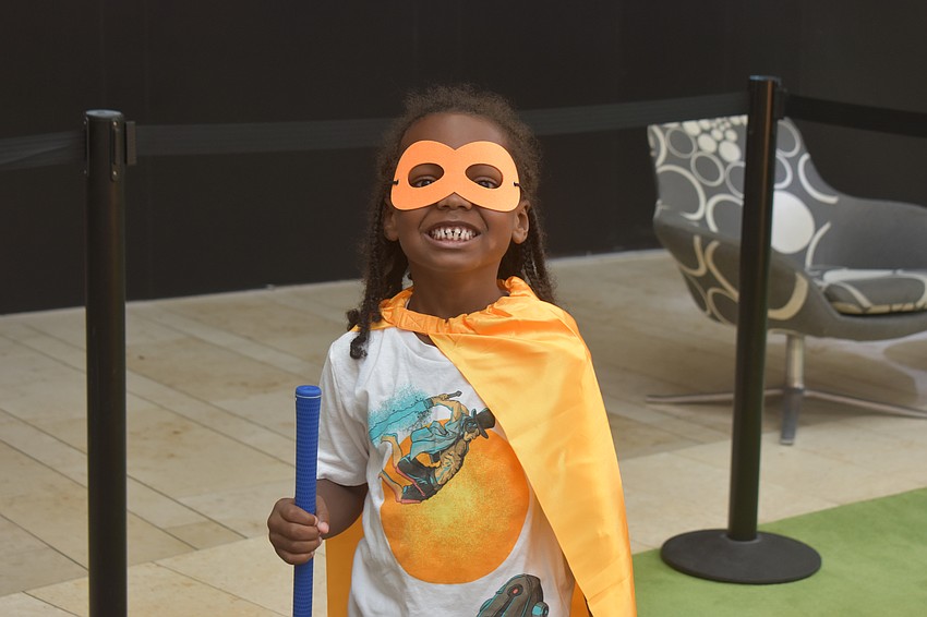 Bradenton resident Jayceon Stackhouse, 7, came to the Dad's Day Block Party with his dad Wayne Johnston. If he was a superhero, Stackhouse would want to be Rylee the Invisible Man.