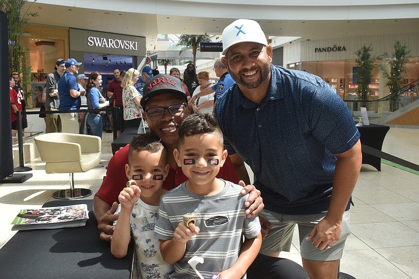 Parrish resident Christopher King brought his family, including sons 5-year-old Cameron and 7-year-old Christopher Jr., to meet former Buccaneers player Shelton Quarles.