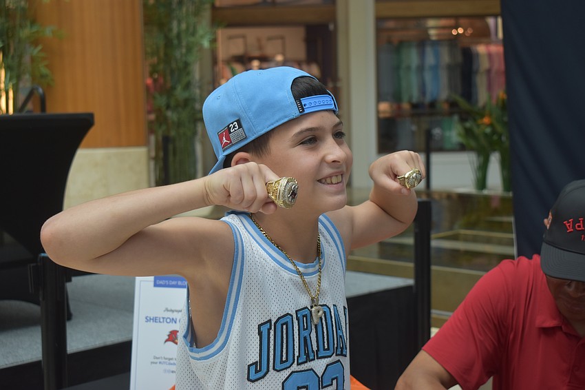 Preston Lambright, a 9-year-old Sarasota resident, was excited when he stumbled upon the meet and greet and got to hold Quarles' Super Bowl rings.
