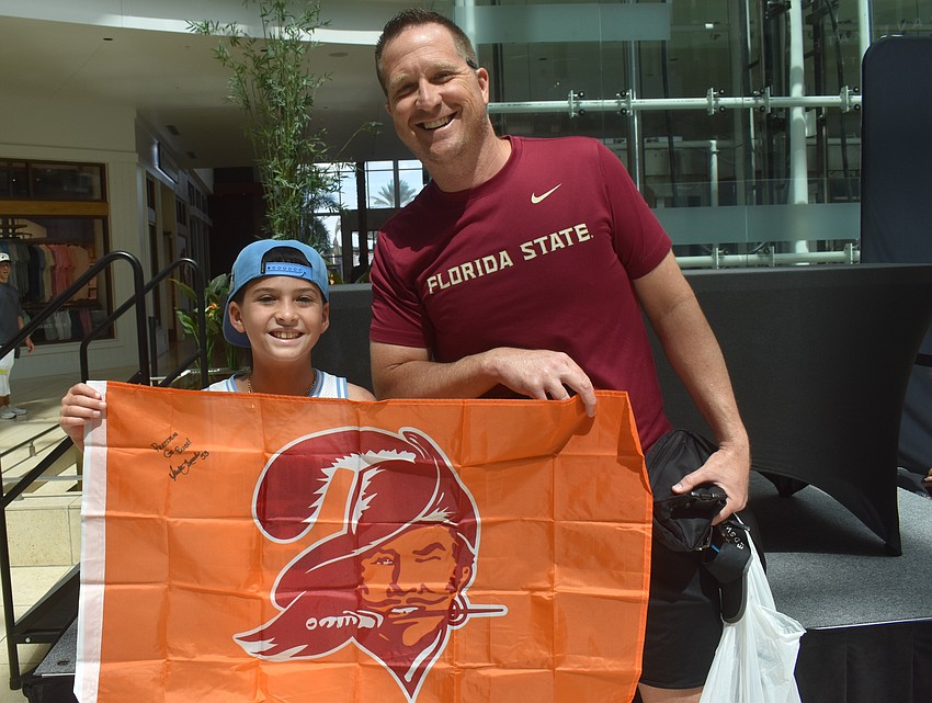 Sarasota resident Steven Lambright and his 9-year-old son Preston Lambright are fans of all things sports, including football and hockey. They were excited to meet former players at the Dad's Day event at the Mall at UTC.